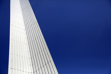 Fototapeta na wymiar Architectural Detail of steel metal a modern geometry with blue sky background with copy space