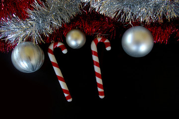 Christmas decoration composition tinsel baubles and candy canes