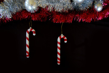 Christmas decoration composition tinsel candy canes and baubles