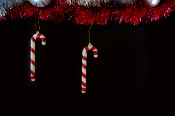 Christmas decoration composition tinsel candy canes and baubles