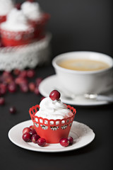 cupcake with cream and cranberries