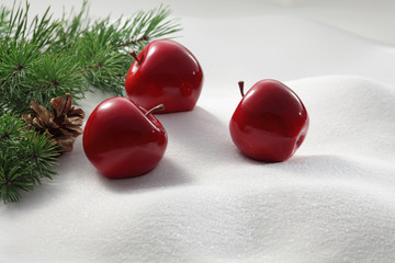 Red apples on snow background