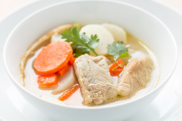 Pork soup and vegetable in a white bowl