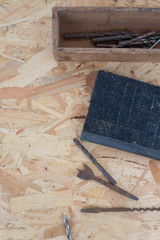 Many tools of the past under wooden background