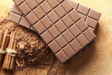 Chocolate bars, cocoa and cinnamon sticks
