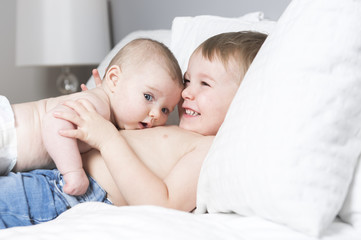 Healthy Lifestyle of young little children boy on bed