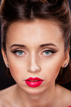 Portrait of styled Woman with brunette hair style and red lips
