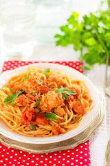 Pasta spaghetti with tuna, capers in tomato sauce