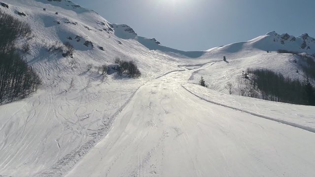 Aerial: Flight over the snowy mountains