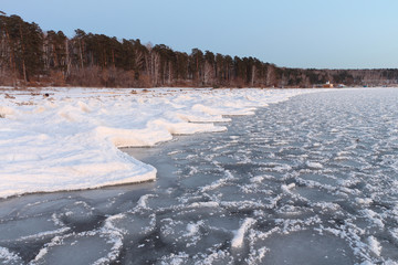 Formation of ice on the river in the fall. River Ob, Russia
