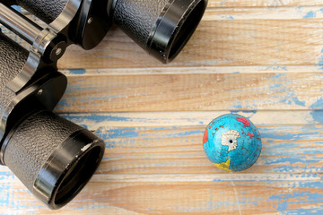 Binoculars and globe 