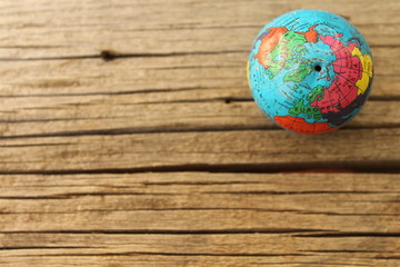 Close up of world globe - top view - travel destination and love different cultures concept - place for text