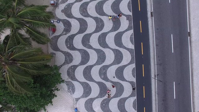 Top View of Copacabana beach with mosaic of sidewalk in Rio de Janeiro. Brazil