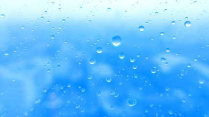 Close-up of water drops on glass surface as background