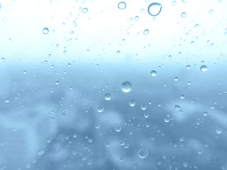 Close-up of water drops on glass surface as background