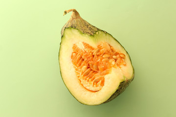 Sliced melon on green background
