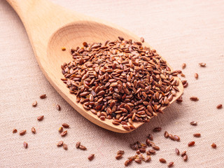 Flax seeds linseed on wooden spoon
