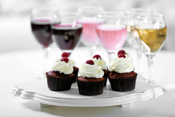 Tasting of wine and chocolate cupcakes, close up