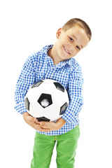Cute boy is holding a football ball made of genuine leather. Isolated on a white background. Soccer ball 