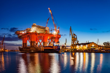 Oil Rig in the shipyard for maintenance at night.
