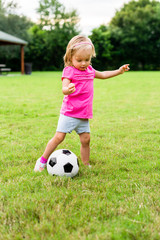 Obraz premium Little Girl With Soccer Football Ball