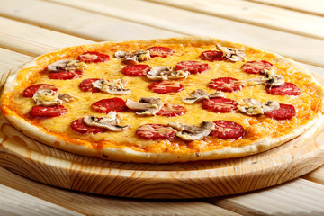 Delicious italian pizzas served on wooden table