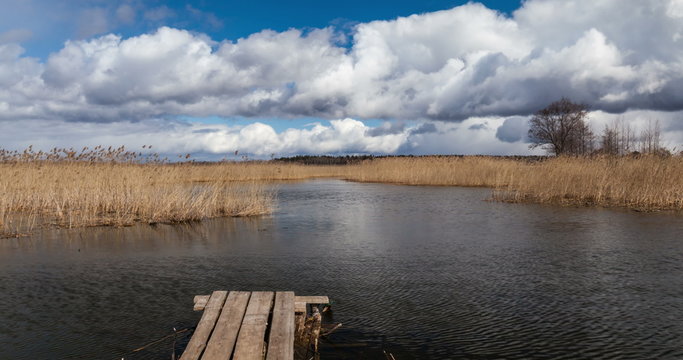 4k timelapse of Braslaw lake Dryaviaty in Belarus with pier and clouds with pan