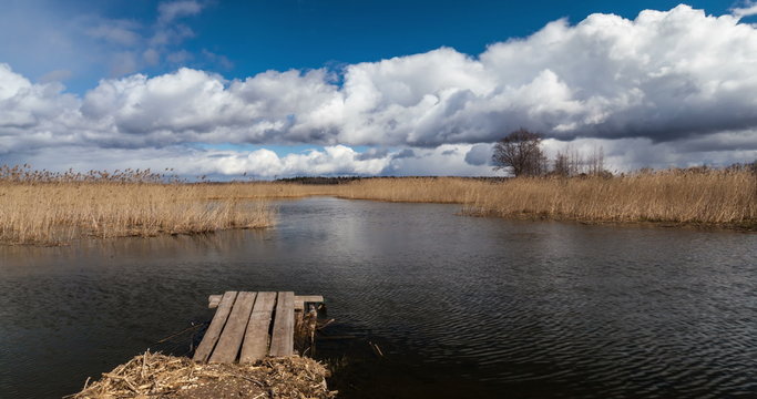 4k timelapse of Braslaw lake Dryaviaty in Belarus with pier and clouds