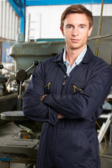 Portrait Of Engineer On Factory Floor