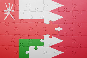 puzzle with the national flag of bahrain and oman