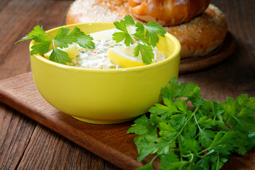 plate with salad and bread rolls at the village table