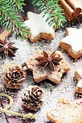 Fototapeta premium Christmas cookies and decoration on a rustic wooden table.Selective focus. 
