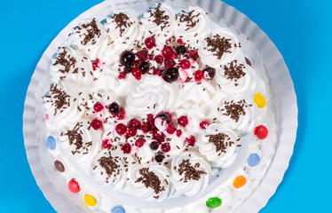 Tasty creamy birthday cake colorful candy adorned