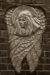 Fototapeta na wymiar sculpture of an angel with dark background