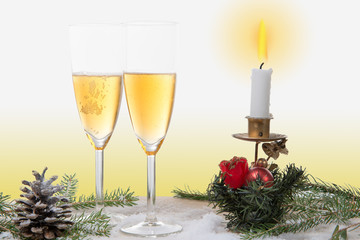 Two glasses of champagne with Christmas decor
