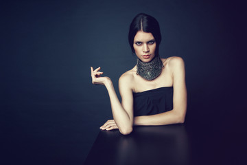 Woman in decorative silver necklace
