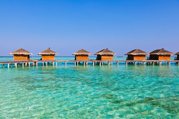 Bungalows on tropical Maldives island