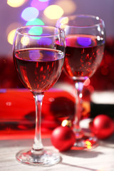 Wine and Christmas decoration on bright background