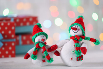 Cute snowmen on Christmas background