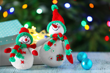 Cute snowmen on Christmas background