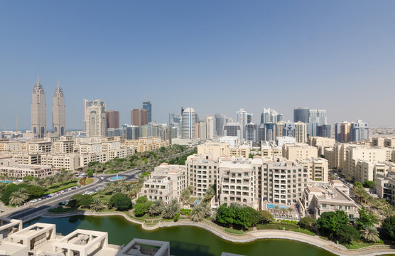 dubai business towers, the greens, tecom living apartment complex in the daytime