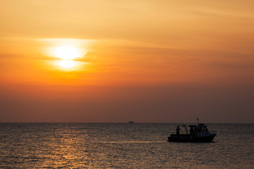 Fototapeta na wymiar Fisherman fishing at sunrise