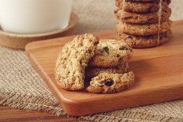 Oat raisin cookies on chopping board