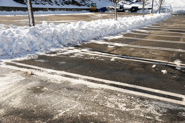 empty parking lot with snow removed