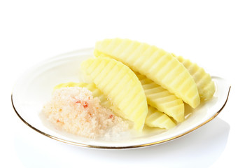 Sliced green mango with chili powder and salt on white backgroun