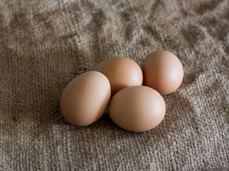 Still Life- laying eggs on burlap.