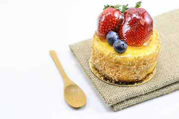 Isolated berries cheesecake on jute, berries sweet dessert on ju