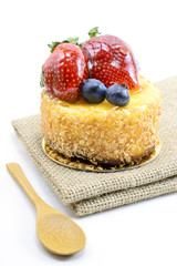 Isolated berries cheesecake on jute, berries sweet dessert on ju