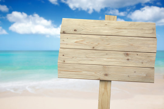 Vintage Rustic Wooden Sign On The Beach