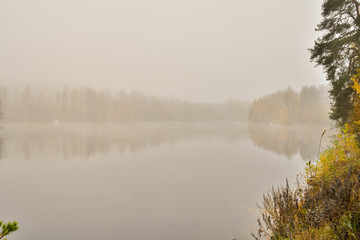 Fototapeta na wymiar Foggy autumn river